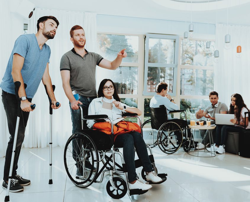 Why Choose Courage Support Services For Community Care - People in Wheelchair. Disabled in Hall. Woman in Wheelchair. Man on Crutches. Room with Panoramic View.